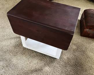 Refurbished vintage rollaway cart with lift able table sides. 