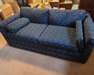 Pair of upholstered sofas in navy. 