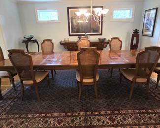 Fabulous Drexel Heritage dining table with three leaves (as shown) Burled Parquetry surface. Akong with eight caned dining chairs (six side, two arms)