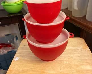 Lots of kitchen containers and pitchers tupperware and rubbermaid