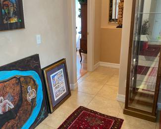 Rugs, artwork, thin China cabinet 