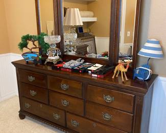 Dresser with lots of bowties and decor on it. There is a matching side table for this.