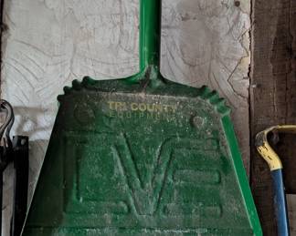 Dust Pan with Tri County Equipment engraved in it