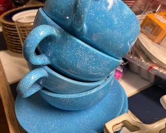 Blue speckled soup cups and plates