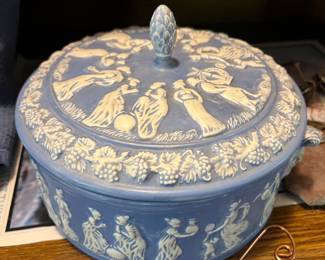 A Wedgwood blue Jasperware lidded oval dish with white relief classical figures.