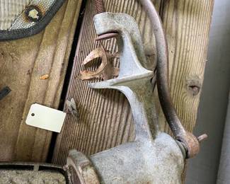 Vintage Universal No. 1 hand-crank cast metal meat grinder with wooden handle.