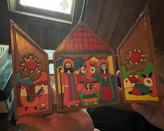 A vintage El Salvadoran folk art wooden triptych Nativity scene.
