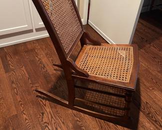 Antique caned rocking chair 