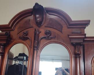 Victorian Walnut Armoire with Carved Pediment and Arched Mirrors