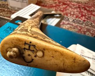 Carved Bone or Ivory Powder Horn with Figural Scenes and Attached Blade