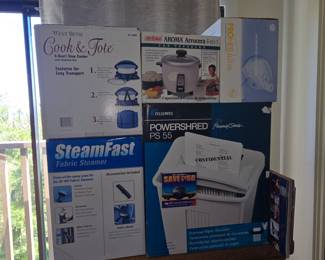 West Bend Cook & Tote 6-Quart Slow Cooker, Aroma Arrocera 4-en-1 Rice Cooker, SteamFast Fabric Steamer, and Fellowes Powershred PS 55 Paper Shredder