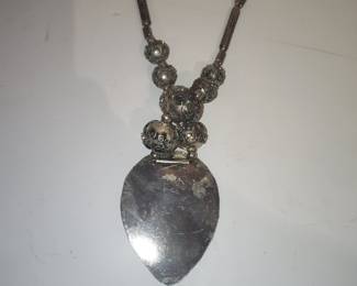 Vintage Silver-Toned Filigree Pendant Necklace with Red Stones