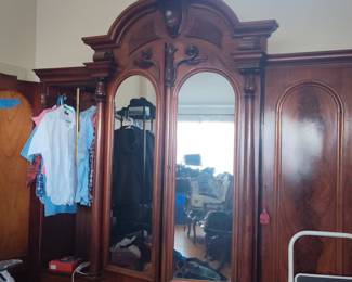 Victorian Walnut Armoire with Carved Pediment and Arched Mirrors