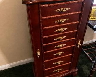 Antique mahogany jewelry chest with ornate details