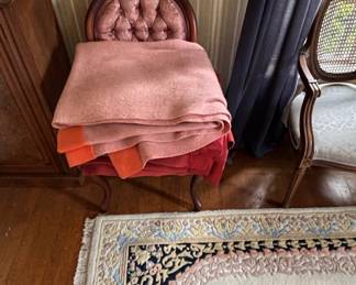 Victorian Tufted Accent Chair with Stacked Blankets