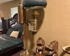 Brass student lamp, laughing Buddhas