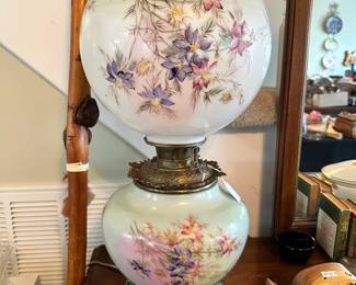 Bradley & Hubbard (B&H) style hurricane lamp featuring a hand-painted floral glass globe and coordinating base. Stunning decorative piece with rich color and classic Victorian-inspired appeal.