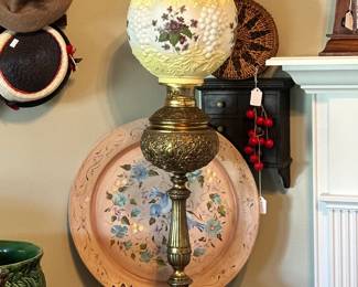Victorian-style banquet/parlor lamp with ornate brass base and floral glass shade. Elegant statement piece with classic detail and strong decorative presence.