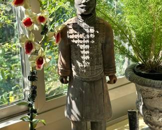 Terracotta warrior-style figurine with detailed armor and bold presence. Striking decorative piece that makes a great statement in any space.