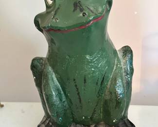 Chalkware frog figurine featuring a hand-painted finish and classic form. Charming decorative piece with vintage appeal.