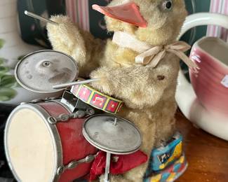 Vintage duck drummer toy, a classic novelty piece with colorful base and drum set. Ideal for vintage toy collectors and display.