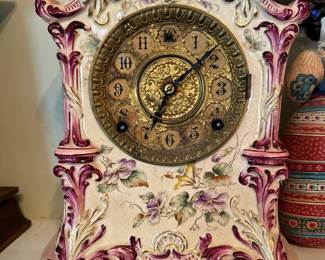 Gilbert porcelain mantel clock, No. 415, circa 1890, featuring an ornate case with hand-painted floral decoration and detailed dial. Beautiful antique piece with strong display presence and classic Victorian character.