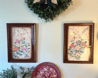 Pair of framed Asian-style bird and flower prints with delicate botanical detail and soft, traditional color palettes. Charming decorative pieces that display beautifully together.
