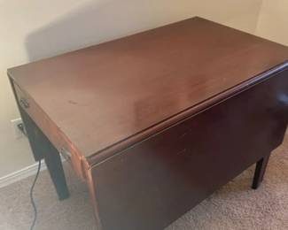 Mature Two Sided Fold Down Dining Table