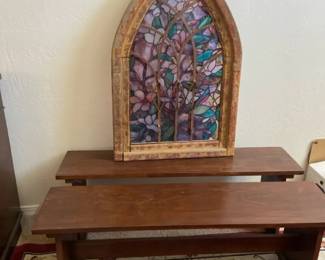Two Church Pews And A Framed Stained Glass Window