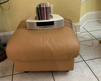 Matching the sofa, in soft tan leather ottoman