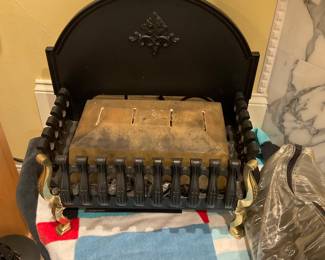 Electric cast iron fireplace grate with “a bag of coal pieces” to simulate real burning coals