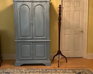 Light blue Armoire/Entertainment top and bottom cabinet. Built in shelving. 40”x78”x20”