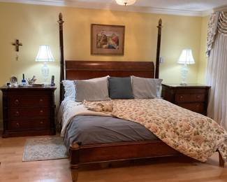 Lovely wooden king size poster bed..87”h ….on platform with headboard and footboard frame.. Beautyrest Harmony Plush Mattress in excellent condition. 