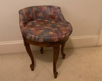 Antique 40s style swivel boudoir vanity chair wooden legs and a patterned upholstered seat