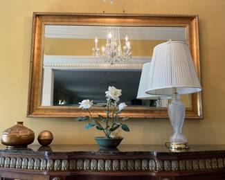 Crystal lamps and golden mirrors throughout the house 