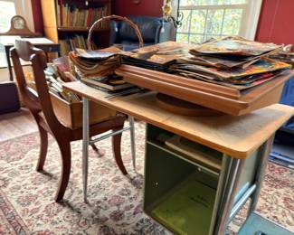 Wood Chrome Desk Table Stacked Magazines Books Papers Wood Dining Chair Oriental Area Rug Vintage Furniture