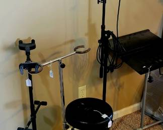 Musician gear including a microphone and stand. 