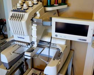 Brother PR-620 embroidery machine on rolling cart. 