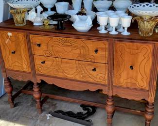 Antique sideboard and vintage milk glass. 