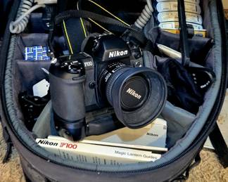 Nikon F100 camera with multiple filters and accessories. 