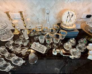 Lenox gold rimmed stemware, crystal candle sticks, decanter and biscuit jar, glass individual gravy boats
