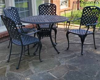 High End Black Cast Aluminum Outdoor Dining Set featuring a lattice design 