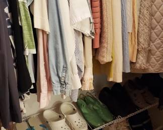 Closet full of gently used clothes and shoes.