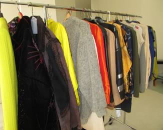 2 racks of luxury brand clothing and some vintage