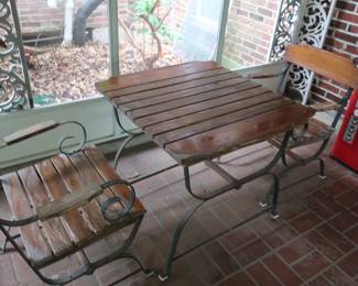 100.00  pair of wood and iron chairs and tables