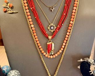 Coral, 18k gold. Removed daily. Security on premises. 