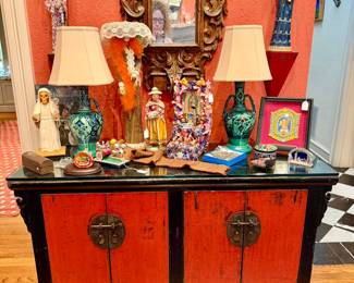 Antique Chinese cabinet loaded with El Dia de Los Muertos. 