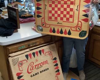 Vintage Carrom board ….games on both sides…and playing pieces …all in original box