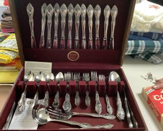 Twelve place settings of flatware with box