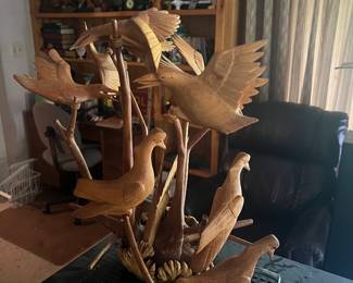 Large hand-carved bird statue